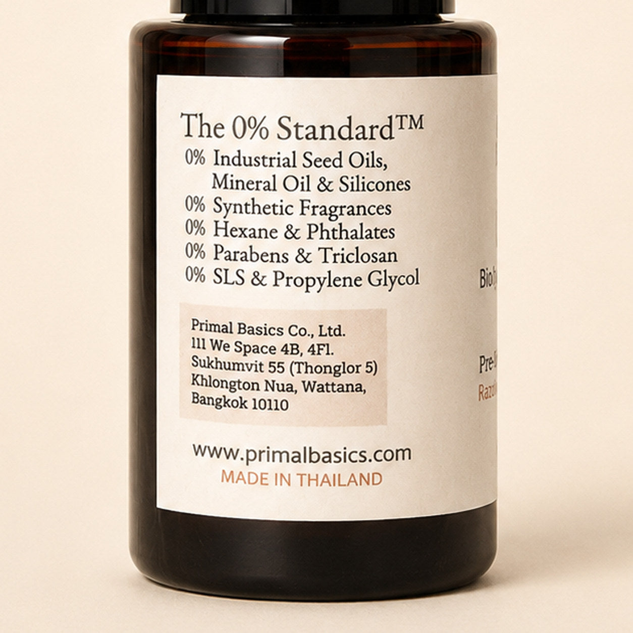 Bio Glide back label zoom — The 0% Standard exclusions and Primal Basics company details