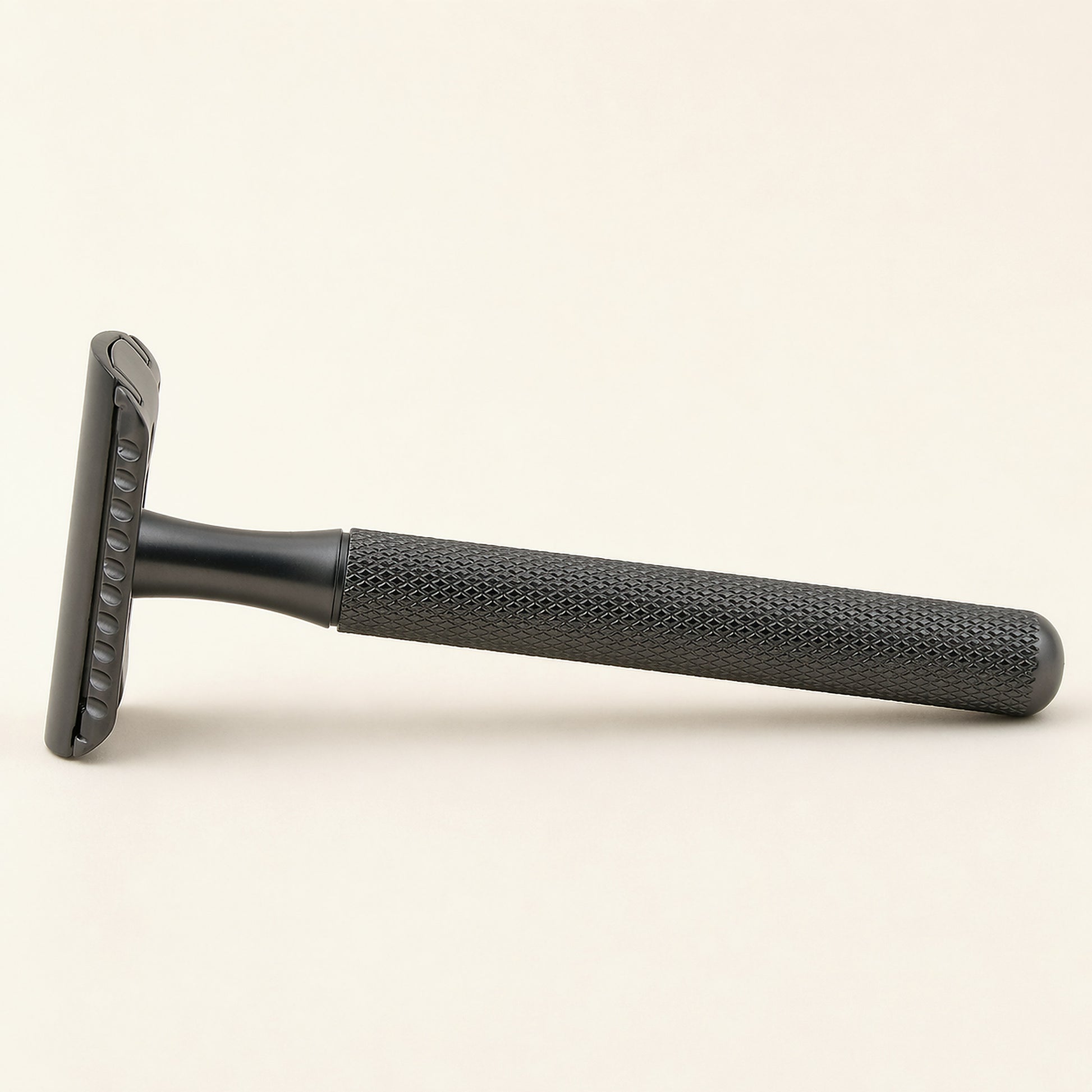 PrimalGlide Essential razor — stainless steel handle, zinc alloy head, front view