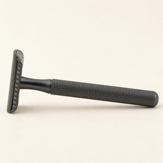 PrimalGlide Essential razor — stainless steel handle, zinc alloy head, front view